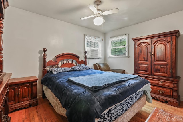 bedroom featuring a ceiling fan and wood finished floors