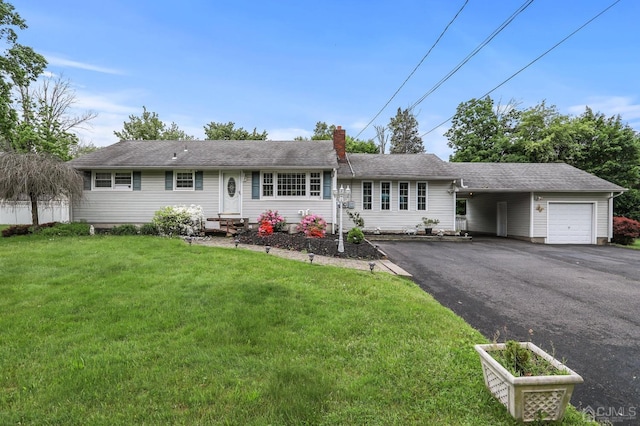 ranch-style home with a garage and a front lawn