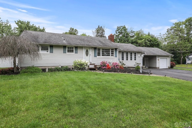 ranch-style house with a garage and a front yard