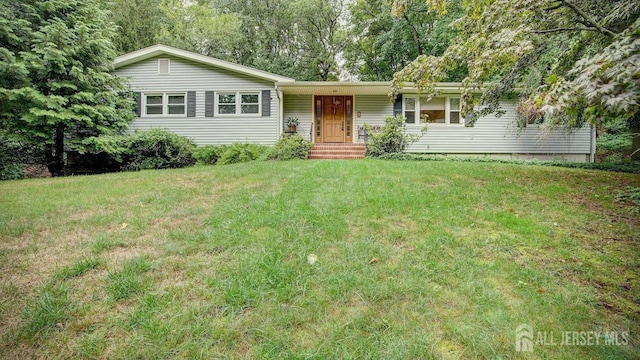 ranch-style home with a front lawn