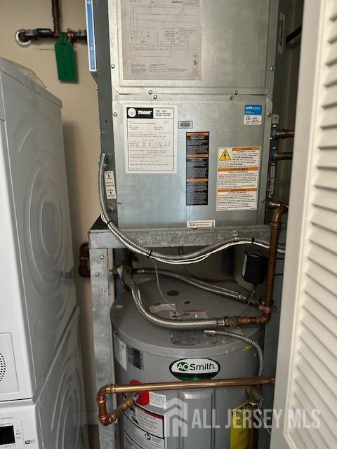 utilities with heating unit and stacked washer / dryer