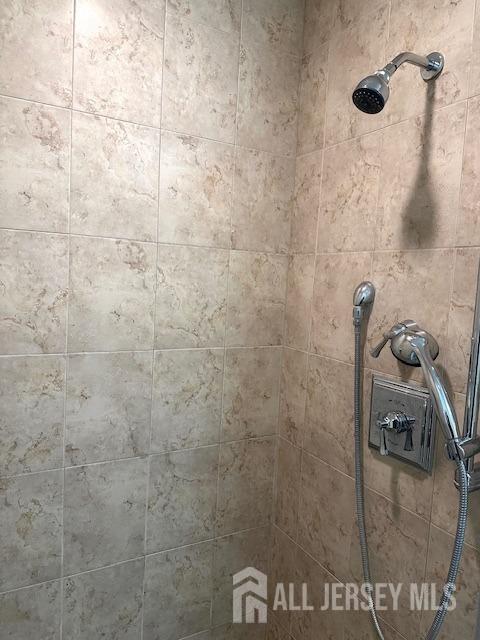 details with a tile shower