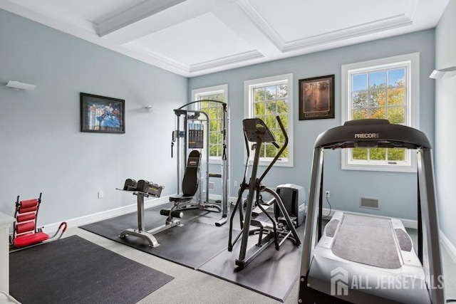 workout room featuring coffered ceiling