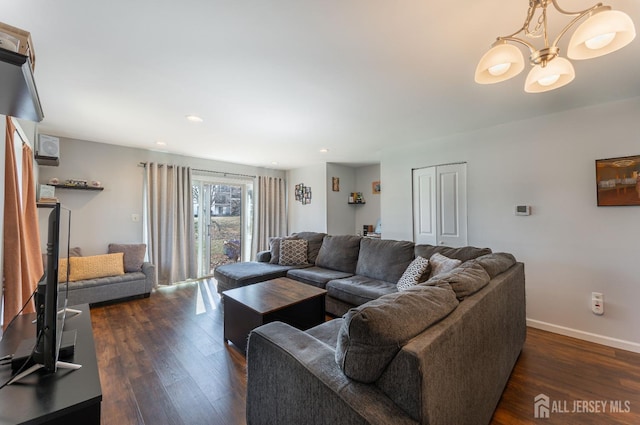 living room with recessed lighting, baseboards, dark wood-type flooring, and a chandelier