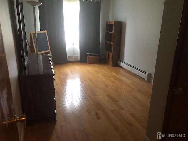 41 Bartha Ave, Edison, NJ 08817 - empty room with baseboard heating, light wood-style flooring, and plenty of natural light
