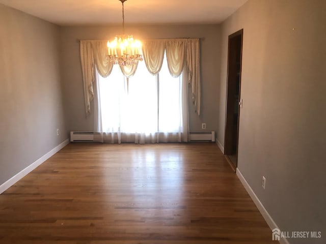 41 Bartha Ave, Edison, NJ 08817 - unfurnished dining area with a chandelier, a baseboard radiator, and wood finished floors