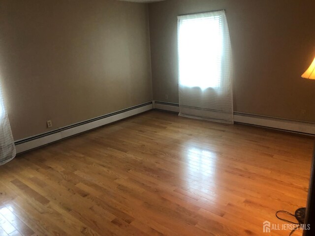 41 Bartha Ave, Edison, NJ 08817 - spare room featuring wood finished floors and baseboard heating
