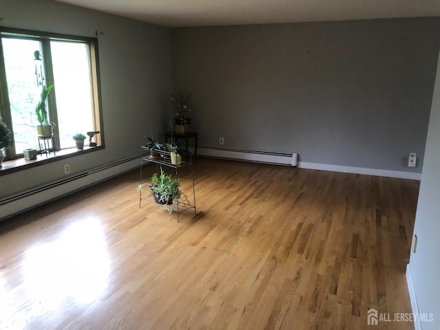 41 Bartha Ave, Edison, NJ 08817 - spare room with baseboard heating and wood finished floors