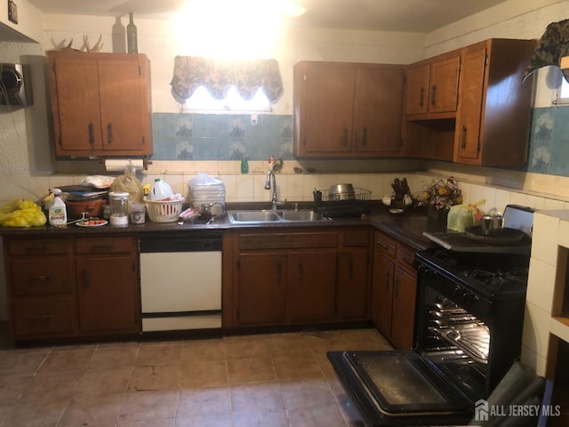 41 Bartha Ave, Edison, NJ 08817 - kitchen with white dishwasher, a sink, dark countertops, stove, and backsplash