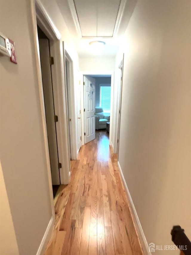 150 School St, Piscataway, NJ 08878 - hallway with light wood-style floors, attic access, and baseboards