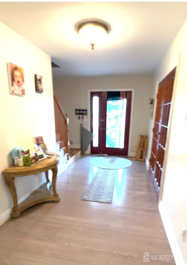 150 School St, Piscataway, NJ 08878 - entryway with stairway, baseboards, and wood finished floors