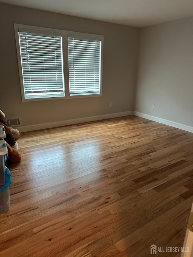 150 School St, Piscataway, NJ 08878 - spare room featuring wood finished floors and baseboards