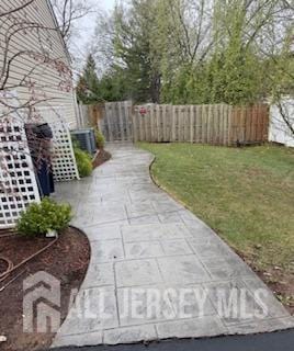 150 School St, Piscataway, NJ 08878 - view of yard featuring central air condition unit and a patio