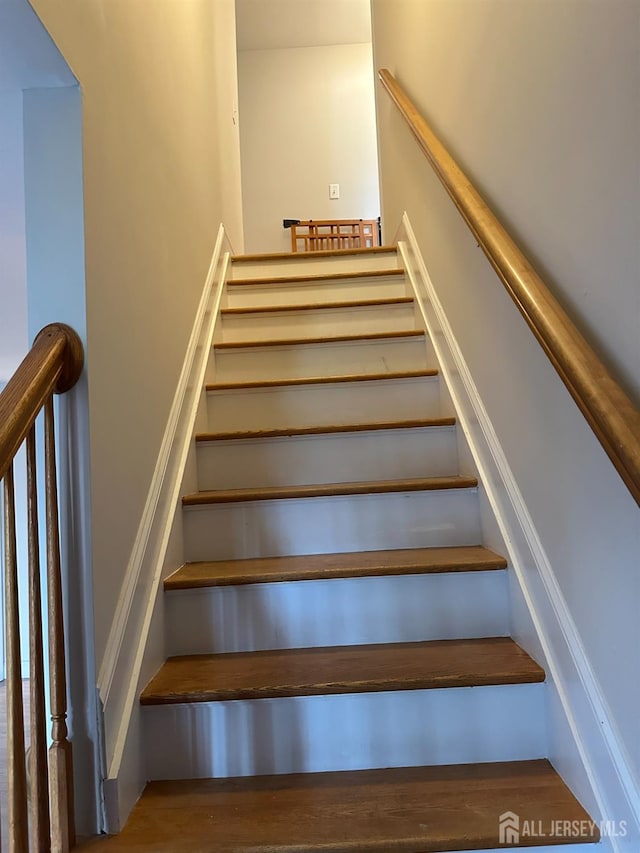 150 School St, Piscataway, NJ 08878 - staircase featuring wood finished floors