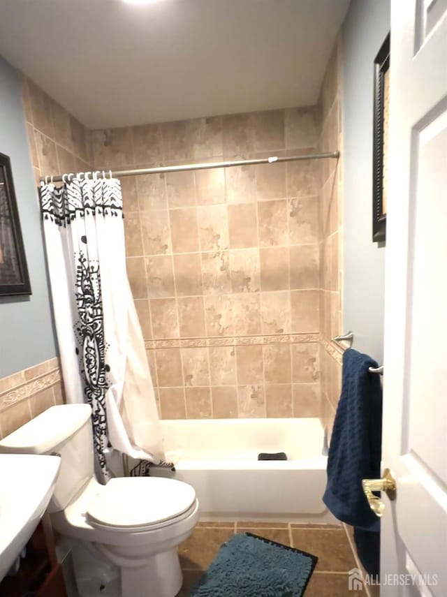 150 School St, Piscataway, NJ 08878 - bathroom featuring tile walls, tile patterned floors, and toilet