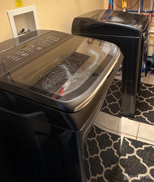 150 School St, Piscataway, NJ 08878 - washroom featuring tile patterned floors and washer and clothes dryer