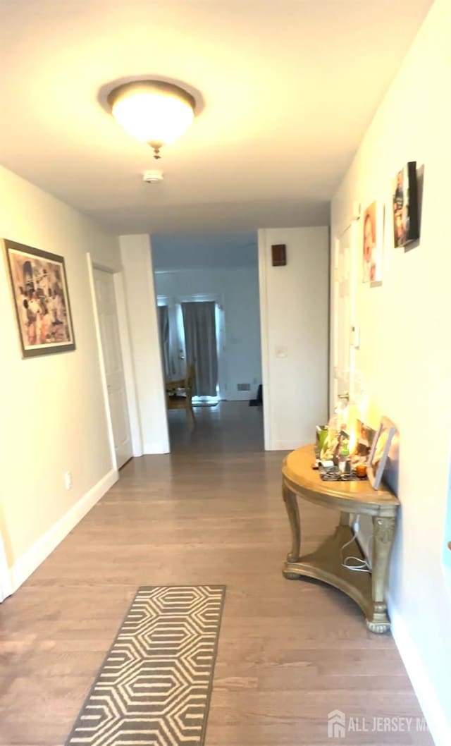 150 School St, Piscataway, NJ 08878 - corridor featuring wood finished floors and baseboards
