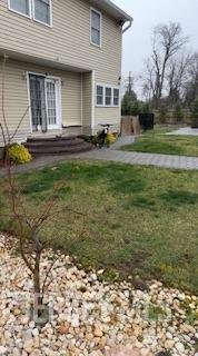 150 School St, Piscataway, NJ 08878 - rear view of house with a yard