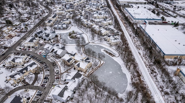 snowy aerial view with a residential view