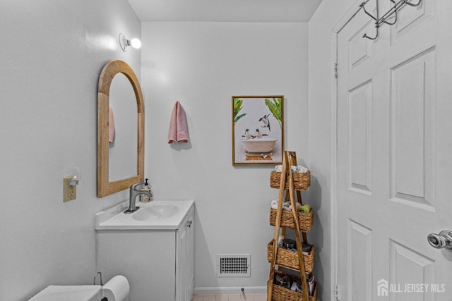 bathroom with visible vents and vanity