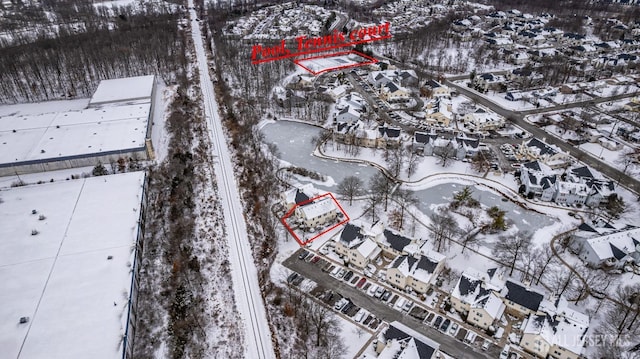 snowy aerial view featuring a residential view