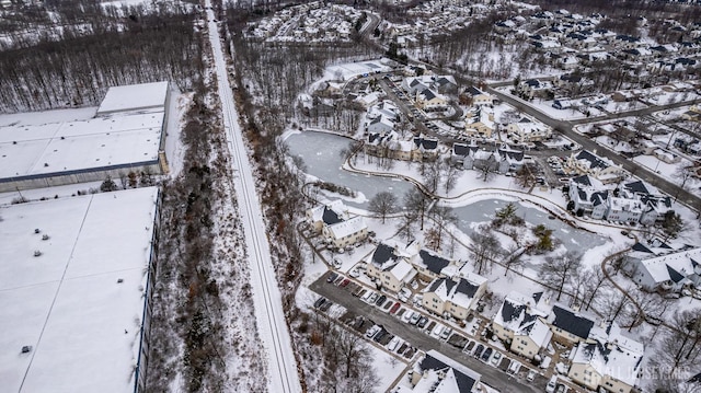 snowy aerial view with a residential view