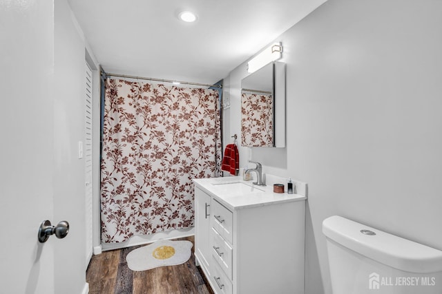 208 Hilltop Blvd, Old Bridge, NJ 07735 - bathroom with vanity, wood finished floors, and a shower with curtain