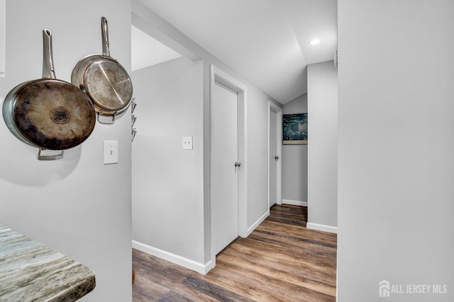 208 Hilltop Blvd, Old Bridge, NJ 07735 - hallway with wood finished floors, vaulted ceiling, and recessed lighting