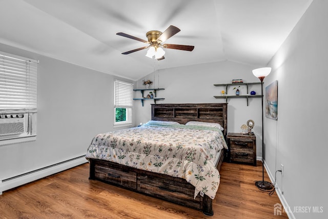 208 Hilltop Blvd, Old Bridge, NJ 07735 - bedroom with baseboard heating, vaulted ceiling, wood finished floors, cooling unit, and a ceiling fan