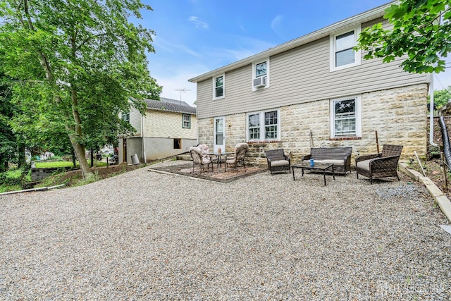 208 Hilltop Blvd, Old Bridge, NJ 07735 - back of house featuring outdoor lounge area, a patio area, and stone siding