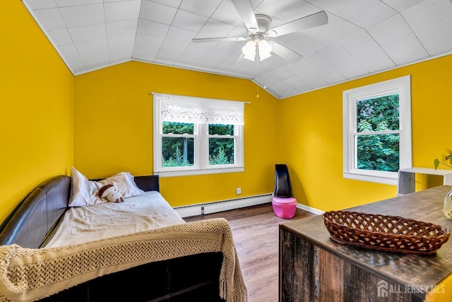 208 Hilltop Blvd, Old Bridge, NJ 07735 - bedroom with a baseboard heating unit, wood finished floors, multiple windows, lofted ceiling, and a ceiling fan