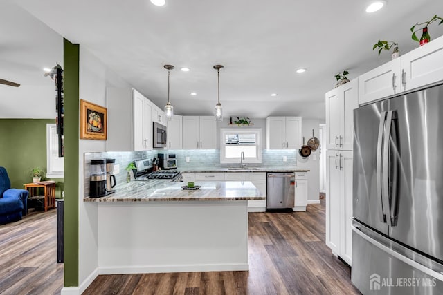 208 Hilltop Blvd, Old Bridge, NJ 07735 - kitchen featuring stainless steel appliances, decorative backsplash, light stone countertops, white cabinets, and recessed lighting