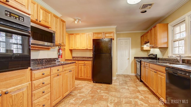 kitchen featuring visible vents, ornamental molding, a sink, black appliances, and under cabinet range hood