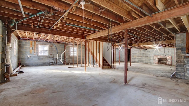 basement featuring stairs