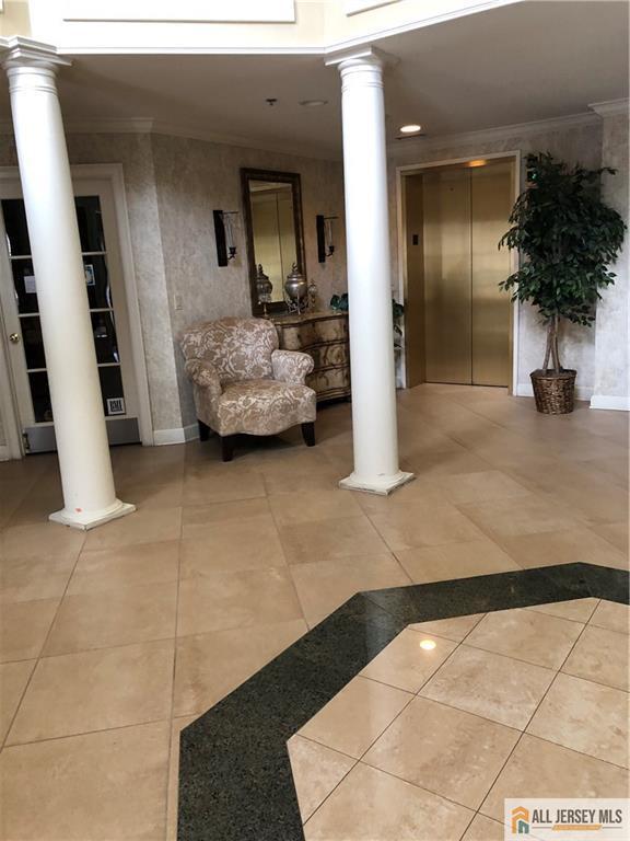 building lobby featuring crown molding