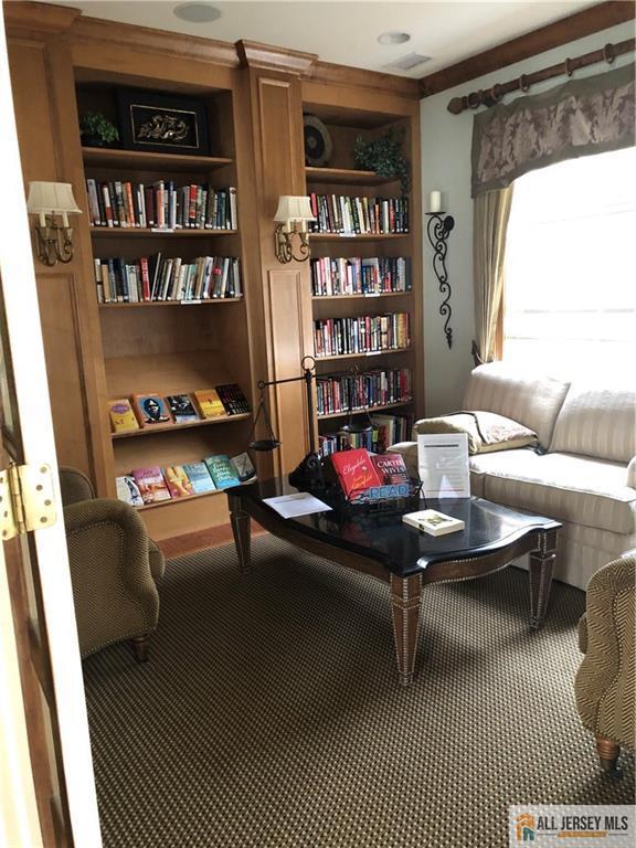 living area featuring carpet floors