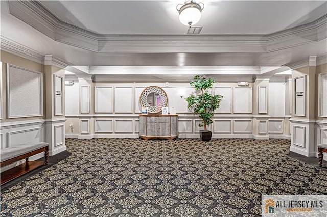 community lobby with a decorative wall and ornamental molding
