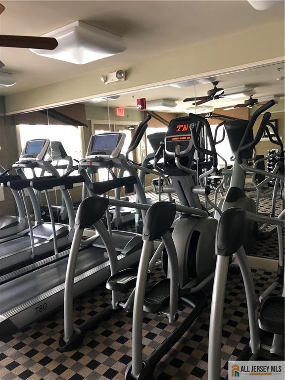 gym featuring ceiling fan