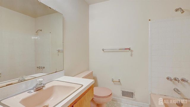 bathroom with toilet, vanity, shower / washtub combination, and tile patterned flooring