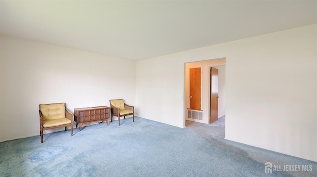 living area featuring carpet flooring