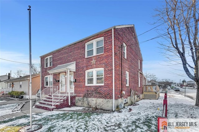 view of property featuring brick siding