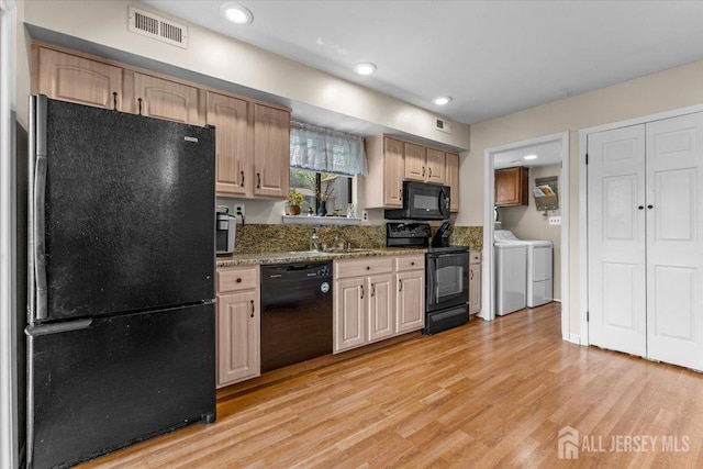 295 Gemini Dr Unit 3D, Hillsborough, NJ 08844 - kitchen featuring black appliances, washer and dryer, light wood-style floors, recessed lighting, and a sink