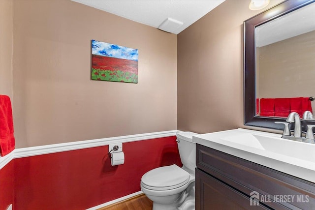 295 Gemini Dr Unit 3D, Hillsborough, NJ 08844 - bathroom with toilet, vanity, and wood finished floors