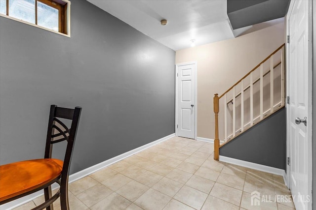295 Gemini Dr Unit 3D, Hillsborough, NJ 08844 - foyer featuring light tile patterned flooring, stairs, and baseboards