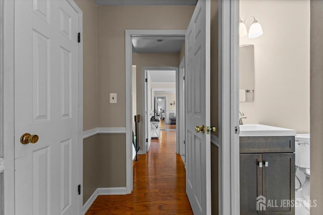 295 Gemini Dr Unit 3D, Hillsborough, NJ 08844 - hall featuring dark wood-style floors and a sink