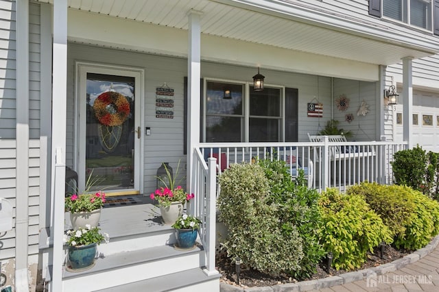 3223 Banta Rd, South Plainfield, NJ 07080 - entrance to property with covered porch and a garage