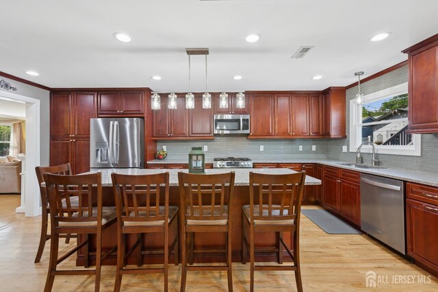 3223 Banta Rd, South Plainfield, NJ 07080 - kitchen with appliances with stainless steel finishes, dark brown cabinets, a sink, tasteful backsplash, and crown molding
