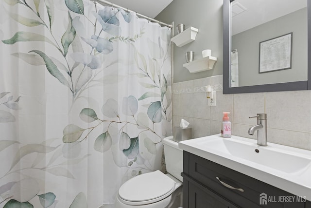 3223 Banta Rd, South Plainfield, NJ 07080 - full bathroom with toilet, vanity, tile walls, and a shower with shower curtain