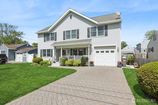 3223 Banta Rd, South Plainfield, NJ 07080 - traditional-style house with a porch, decorative driveway, and an attached garage