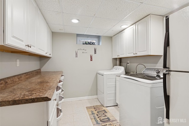 3223 Banta Rd, South Plainfield, NJ 07080 - laundry room featuring cabinet space, washing machine and clothes dryer, recessed lighting, baseboards, and light tile patterned flooring